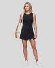 Woman wearing the Athlesi CourtClub Tie-Front Dress in Black, full-body front view.