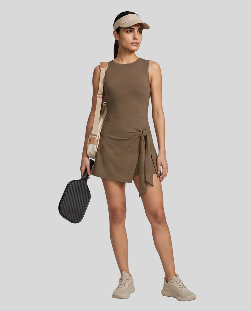 Woman wearing the Athlesi CourtClub Tie-Front Dress in Coffee, full-body front view.