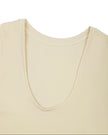 Close-up of the scoop back neckline on the Athlesi CourtClub Tie-Front Dress in Light Apricot.