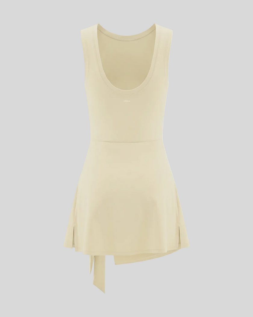 Athlesi CourtClub Tie-Front Dress in Light Apricot, back view with scoop neckline and flared skirt.
