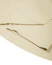 Close-up of the skirt and built-in shorts construction on the Athlesi CourtClub Tie-Front Dress in Light Apricot.