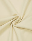 Detailed view of the flexible nylon-blend fabric on the Athlesi CourtClub Tie-Front Dress in Light Apricot.