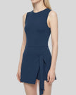 Side angle view of Navy Blue CourtClub Tie-Front Dress with a wrap-style skirt and side tie detail, shown on a model against a plain white background.