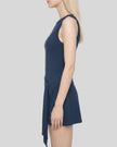 A side-profile view of a model wearing a Navy Blue CourtClub Tie-Front Dress with a side slit, set against a plain white background.