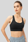 Front angle view of Athlesi CourtEase longline sports bra in black