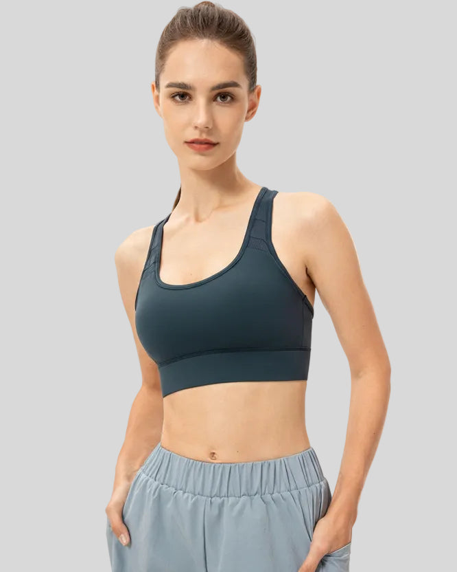 Athlesi CourtEase longline sports bra in deep teal, front view