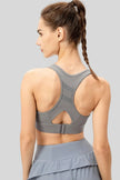 Back view of Athlesi CourtEase sports bra showing racerback cutout design in light gray