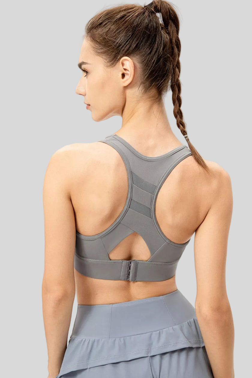 Back view of Athlesi CourtEase sports bra showing racerback cutout design in light gray
