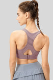 Back view of Athlesi CourtEase sports bra showing racerback cutout design in mauve