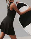Back view of the CourtFlow Active Dress in black showing wide straps and built-in liner
