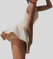 Side view of the CourtFlow Active Dress in Cream highlighting fluid skirt and active fit