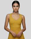 CourtFlow Active Dress in cream with V-neck silhouette and wide straps, studio front view closeup