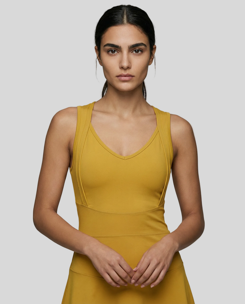 CourtFlow Active Dress in cream with V-neck silhouette and wide straps, studio front view closeup