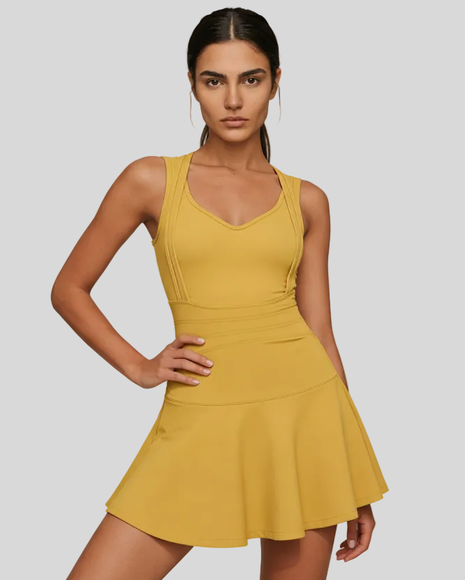 CourtFlow Active Dress in mustard with V-neck silhouette and wide straps, studio front view