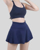 Dark blue athletic skort with a flowy skirt overlay and built-in compression shorts - Athlesi