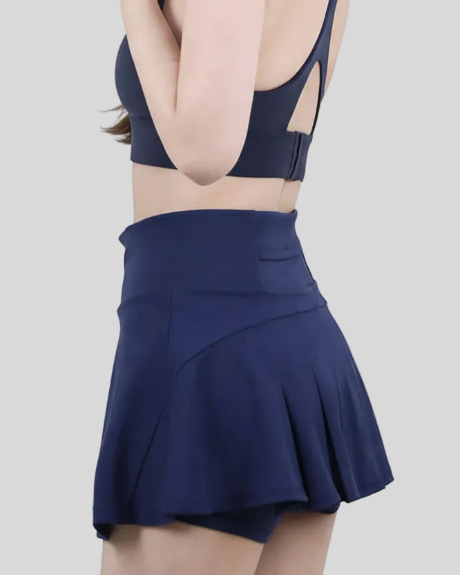 Dark blue performance skort featuring sporty performance fabric -Athlesi
