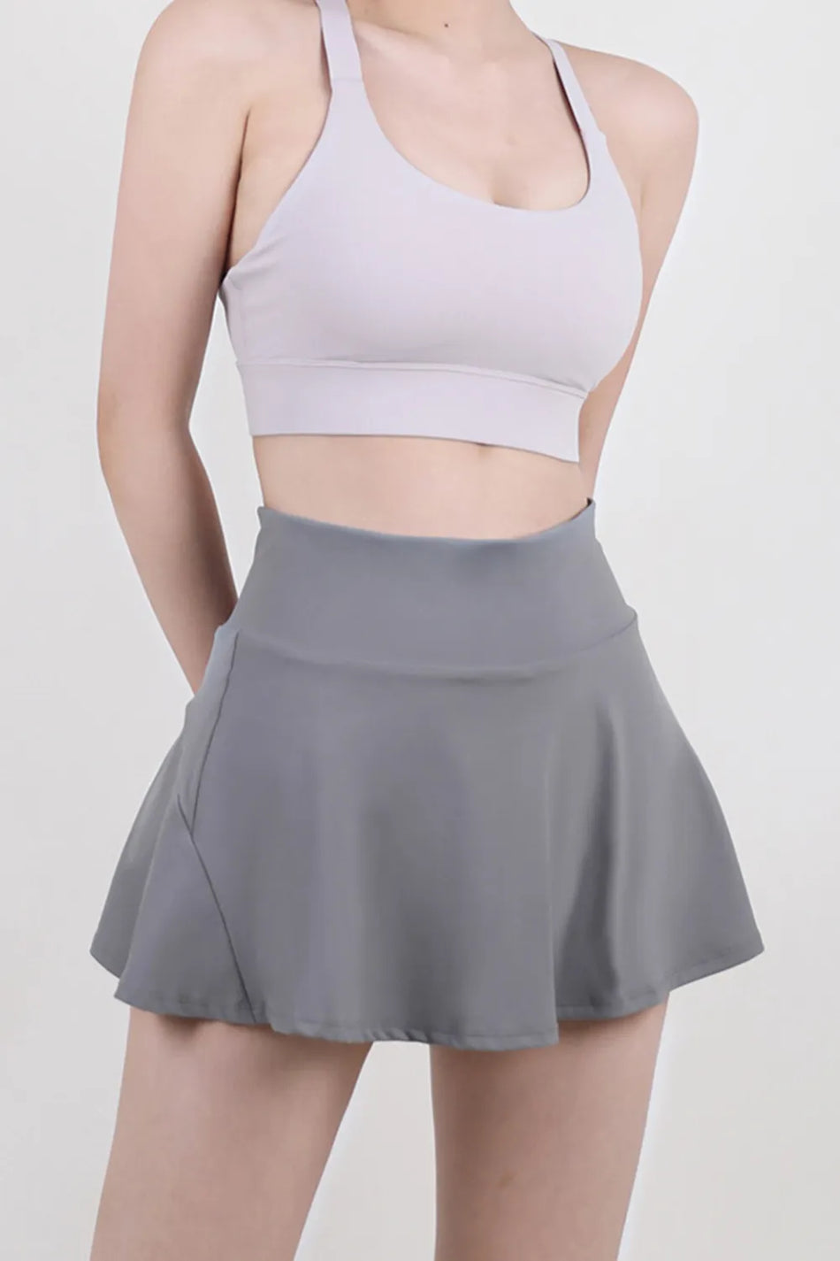 Dark gray athletic skort with a flowy skirt overlay and built-in compression shorts - Athlesi
