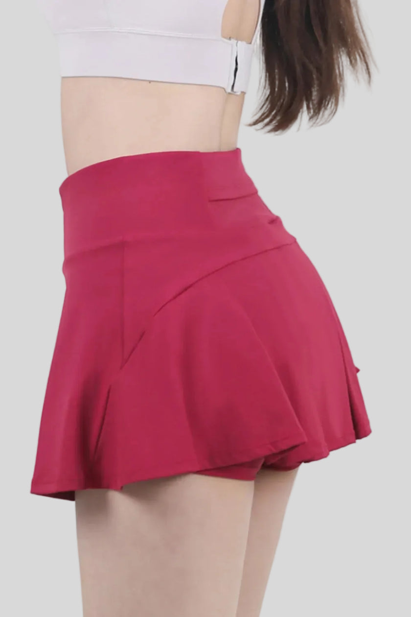 Hot pink performance skort featuring sporty performance fabric -Athlesi