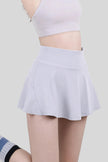 White athletic skort with a flowy skirt overlay and built-in compression shorts - Athlesi