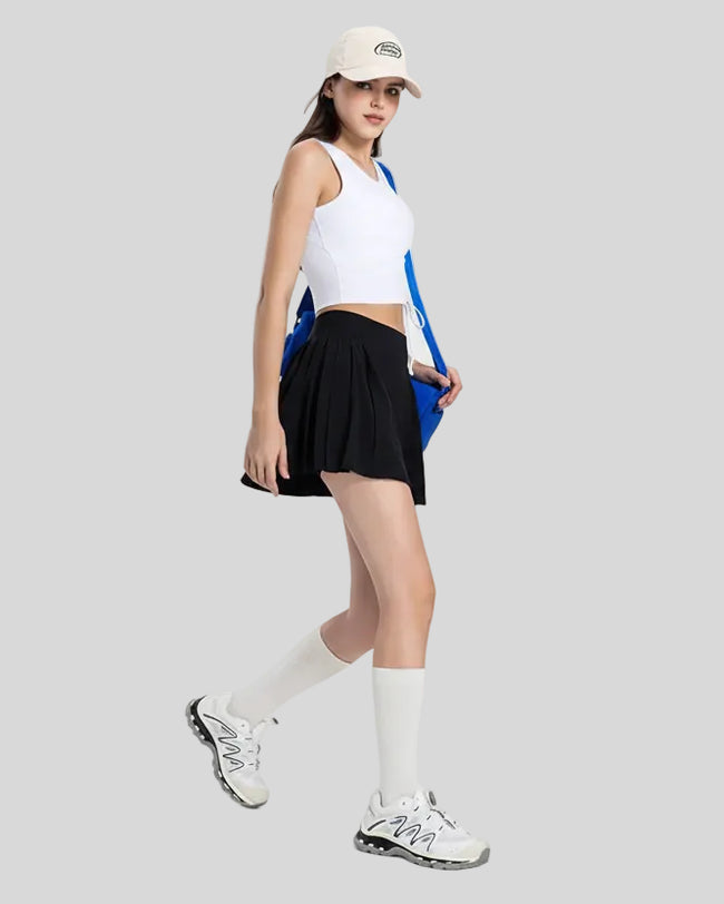 Full body right side view of Athlesi CourtLine Active Skirt in motion