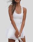 Front closeup of active dress highlighting wide straps and smooth performance fabric in white