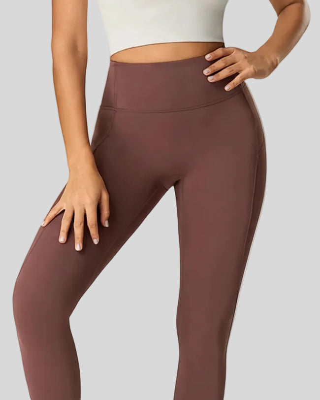 Closeup of high-rise waistband and hip contour on CurveSculpt Legging in dark brown