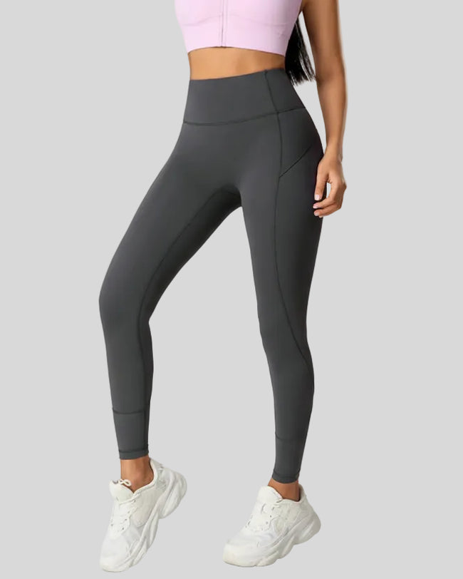 Front angle view of CurveSculpt Contour Legging in dark gray, highlighting curved leg seams