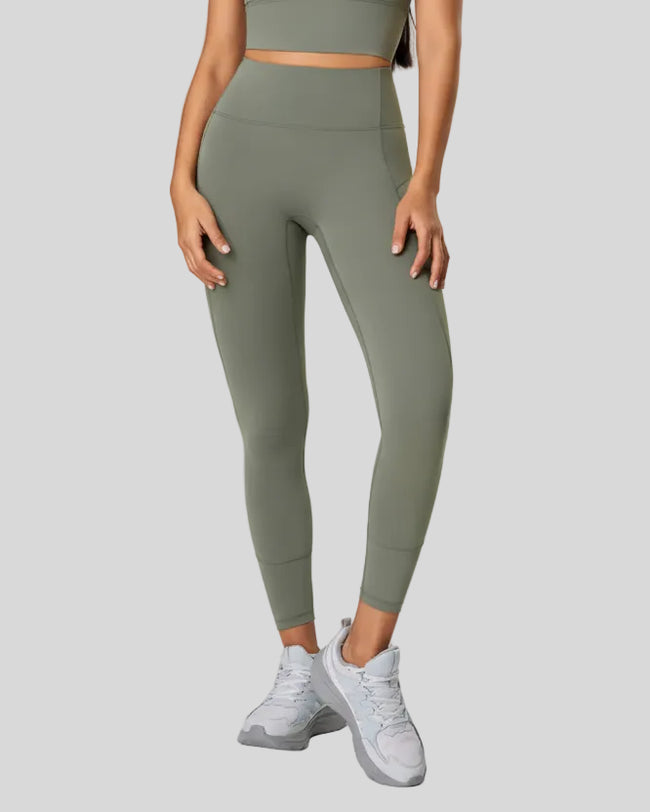 Front view of CurveSculpt Contour Legging in sage with sculpting seams