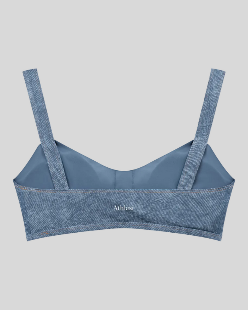 Back view of DenimForm Sculpt Bra in light blue flatlay