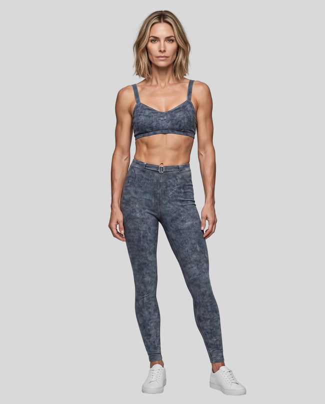 Full body view of model wearing DenimForm Sculpt Legging with matching sports bra in Jeans Blue