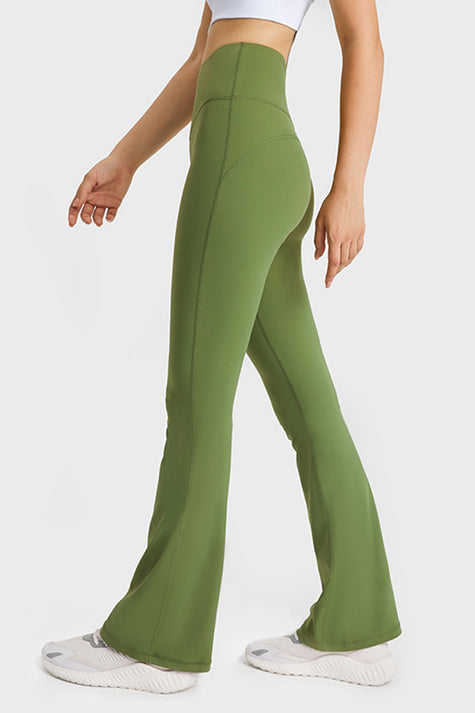 Effortless movement of EarthFlow Flare Yoga Pant in Green - Athlesi