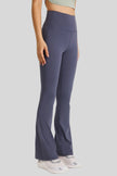 Solid, minimalist design of EarthFlow Flare Yoga Pant in Navy - Athlesi