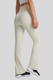 Effortless movement of EarthFlow Flare Yoga Pant in White - Athlesi