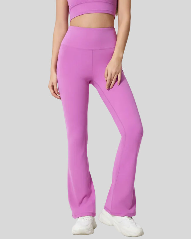Front angle of EarthFlow Lounge Flare Pant in heliotrope purple showing relaxed flare fit