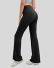 Back angle of EarthFlow Sculpt Flare Pant in black showing smooth fit and flowing flare