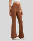 EarthFlow Sculpt Flare Pant in caramel, front angle showing sculpted waist and flared leg