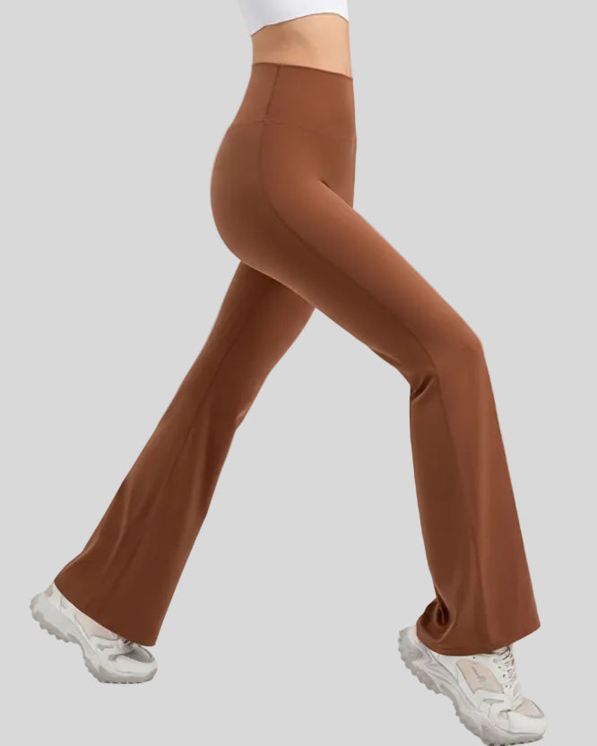Side view of EarthFlow Sculpt Flare Pant in caramel highlighting wide waistband and flare