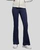 EarthFlow Studio Flare Pant in dark blue styled with an active jacket, front view