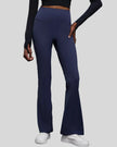Front side view of EarthFlow Studio Flare Pant in dark blue showing high-waist fit
