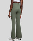 Back view of EarthFlow Studio Flare Pant in sage with clean, seamless waistband