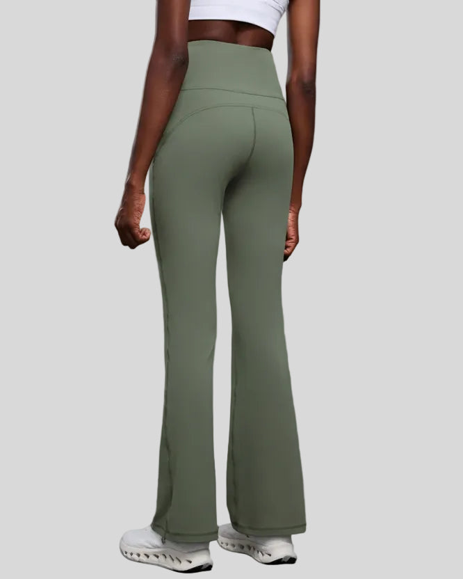 Back view of EarthFlow Studio Flare Pant in sage with clean, seamless waistband