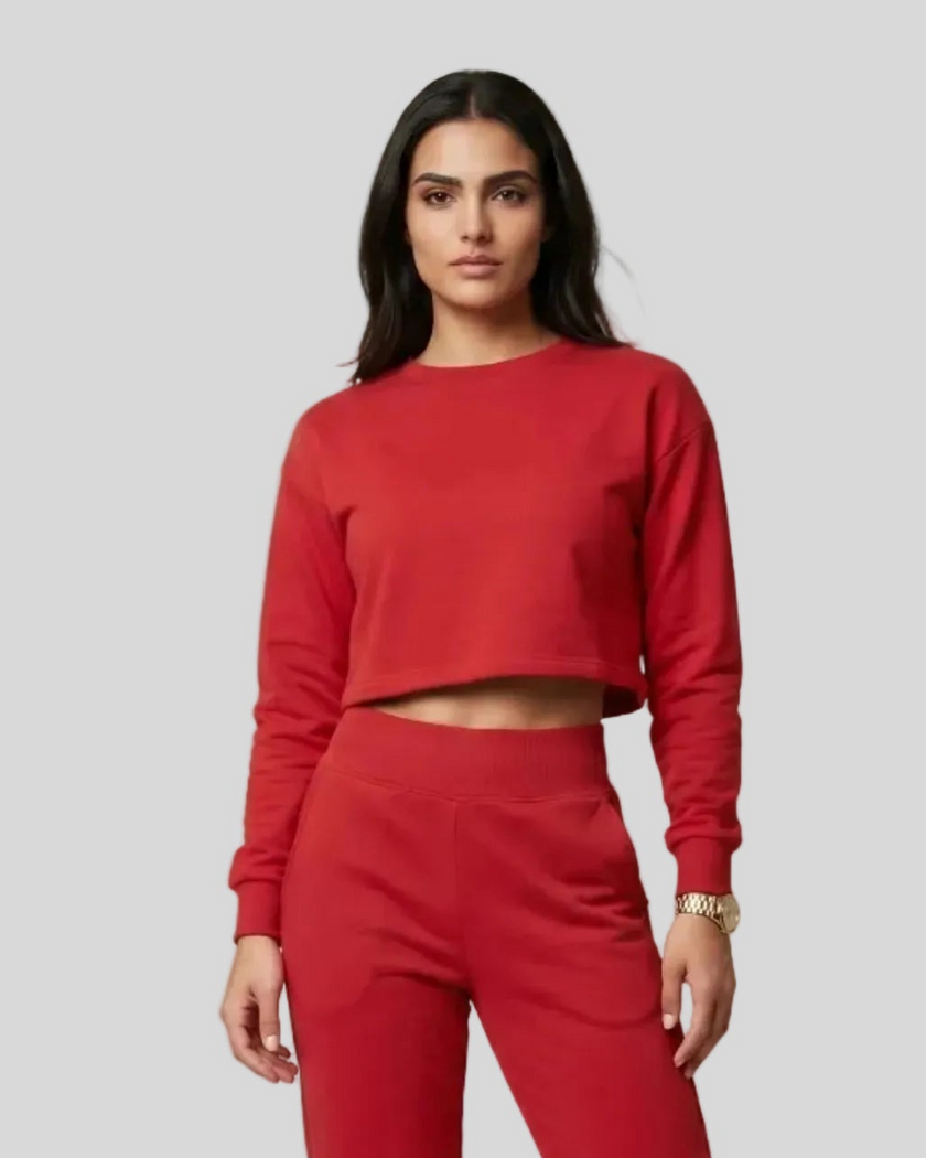 Upper body view of model wearing red Athlesi EaseForm cropped sweatshirt and jogger set