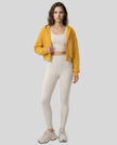 EaseForm Zip Hoodie Jacket in mustard worn by model full body front view styled in a clean studio setting
