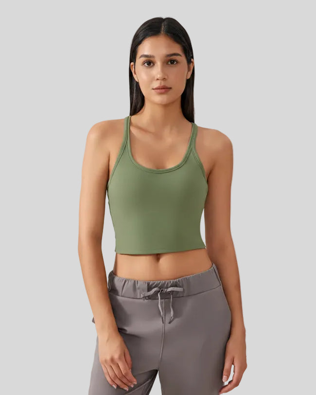 EaseSculpt Scoop Neck Tank in moss worn by model, featuring cropped length