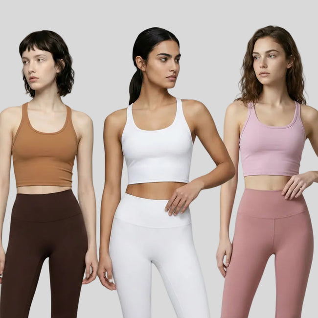 Three women wearing different colored EaseSculpt Tank Tops on a neutral setting
