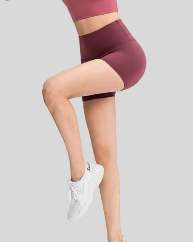 Side view of Athlesi EasyFlex wide-waistband short in burgundy