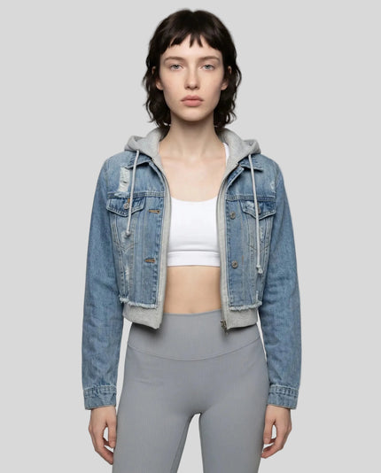 Woman wearing a dark blue and gray Athlesi EdgeForm denim hoodie jacket with gray leggings, mid body front view on model showing cropped fit and layered hoodie 