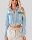 Athlesi EdgeForm denim hoodie jacket in light blue and gray, angled closed view highlighting cropped cut and layered hoodie
