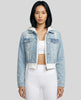 Woman wearing a light blue and white Athlesi EdgeForm denim hoodie jacket with white leggings, mid body front view on model showing cropped fit and layered hoodie 