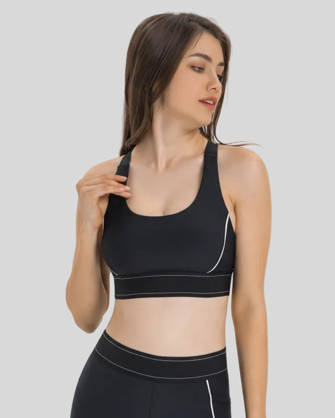 Angled front view of the EdgeForm Sports Bra in Black highlighting sculpted fit and contrast lines